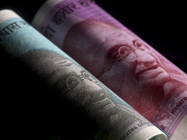 Rupee plummets 105 paise to close at Rs 74.47 against US dollar amid Covid